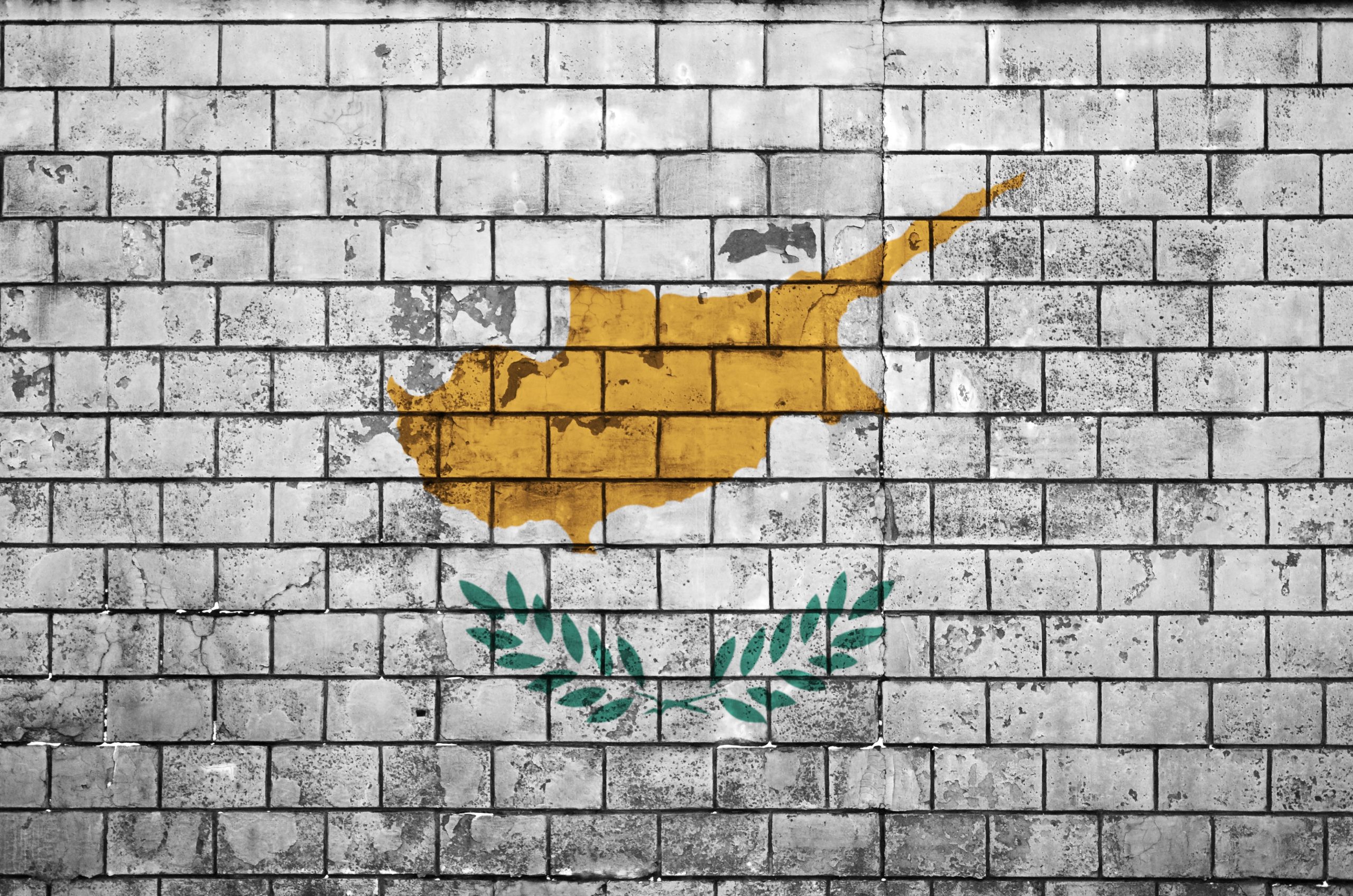 Cyprus flag is painted onto an old brick wall